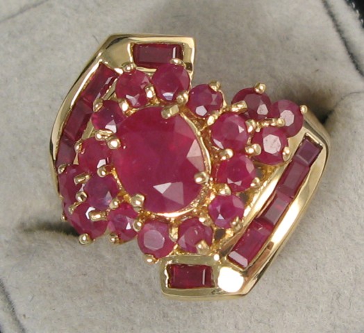 Appraisal: RUBY AND FOURTEEN KARAT GOLD RING centering an oval-cut ruby