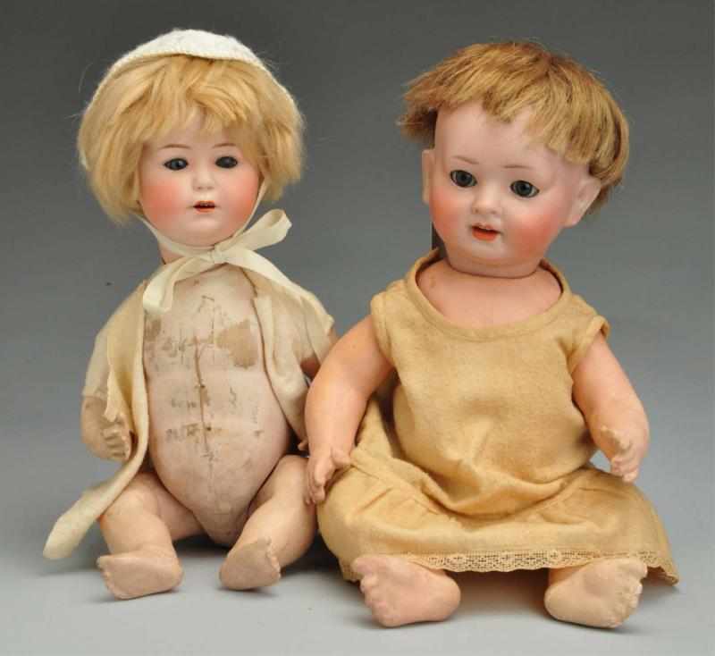 Appraisal: Lot of German Bisque Character Dolls Description Both with bisque