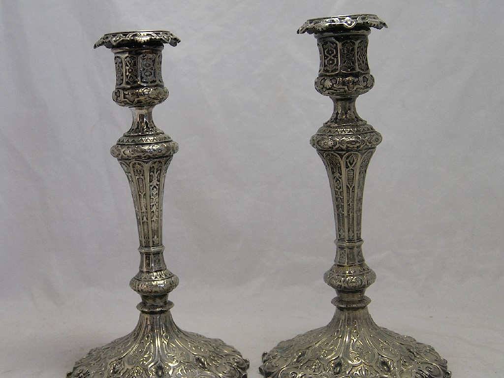 Appraisal: A pair of Victorian Gothic Elkington Co candlesticks with cast