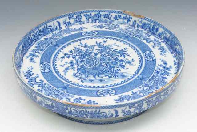 Appraisal: A TH CENTURY BLUE AND WHITE FLOWER DECORATED CIRCULAR CHEESE