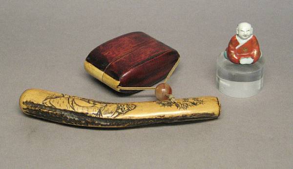 Appraisal: A stag antler pipe case and lacquered wood tonkotsu Meiji