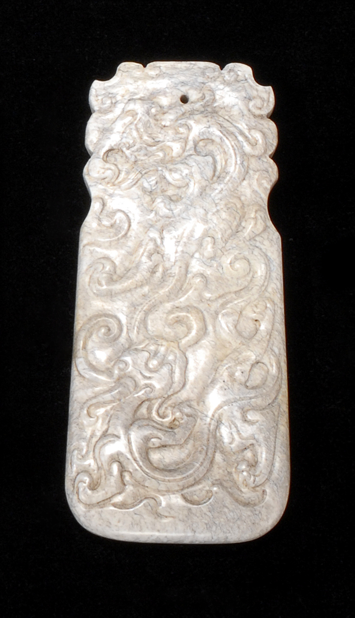 Appraisal: CHICKEN BONE JADE PENDANT In axe form With bat and