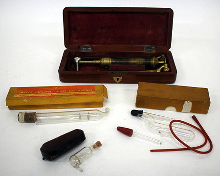 Appraisal: A MOORES PATENT EAR SYRINGE with turned brass body and