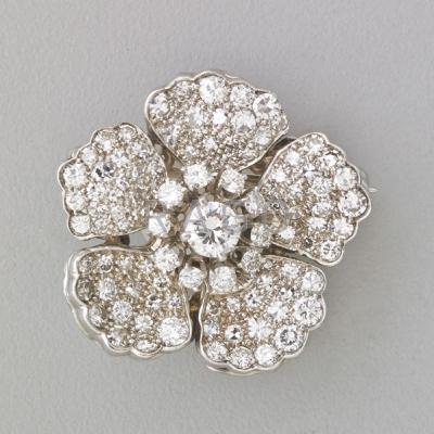 Appraisal: DIAMOND K WHITE GOLD FLOWER BROOCH Principal brilliant cut diamond