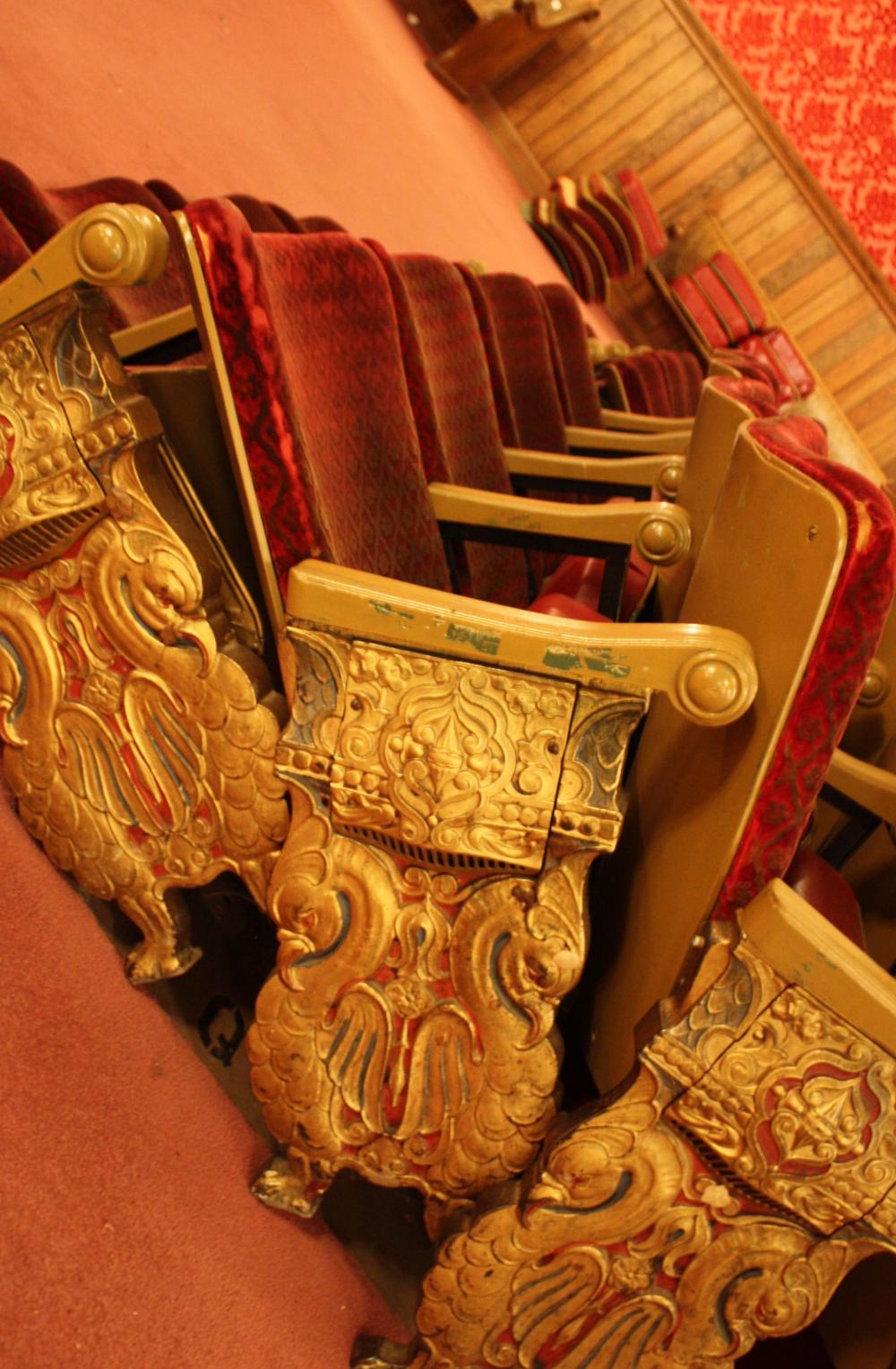 Appraisal: A ROW OF EIGHT VINTAGE THEATER SEATS approximate length