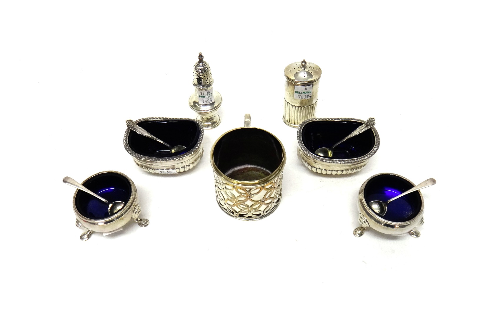 Appraisal: Silver condiments comprising a pair of circular salts each raised