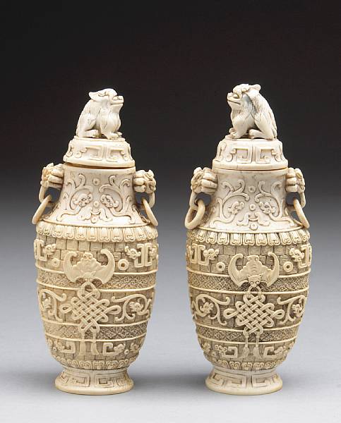 Appraisal: A pair of small ivory covered urns th Century Each