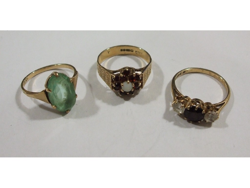 Appraisal: Three ct gold stone set rings to include opal and