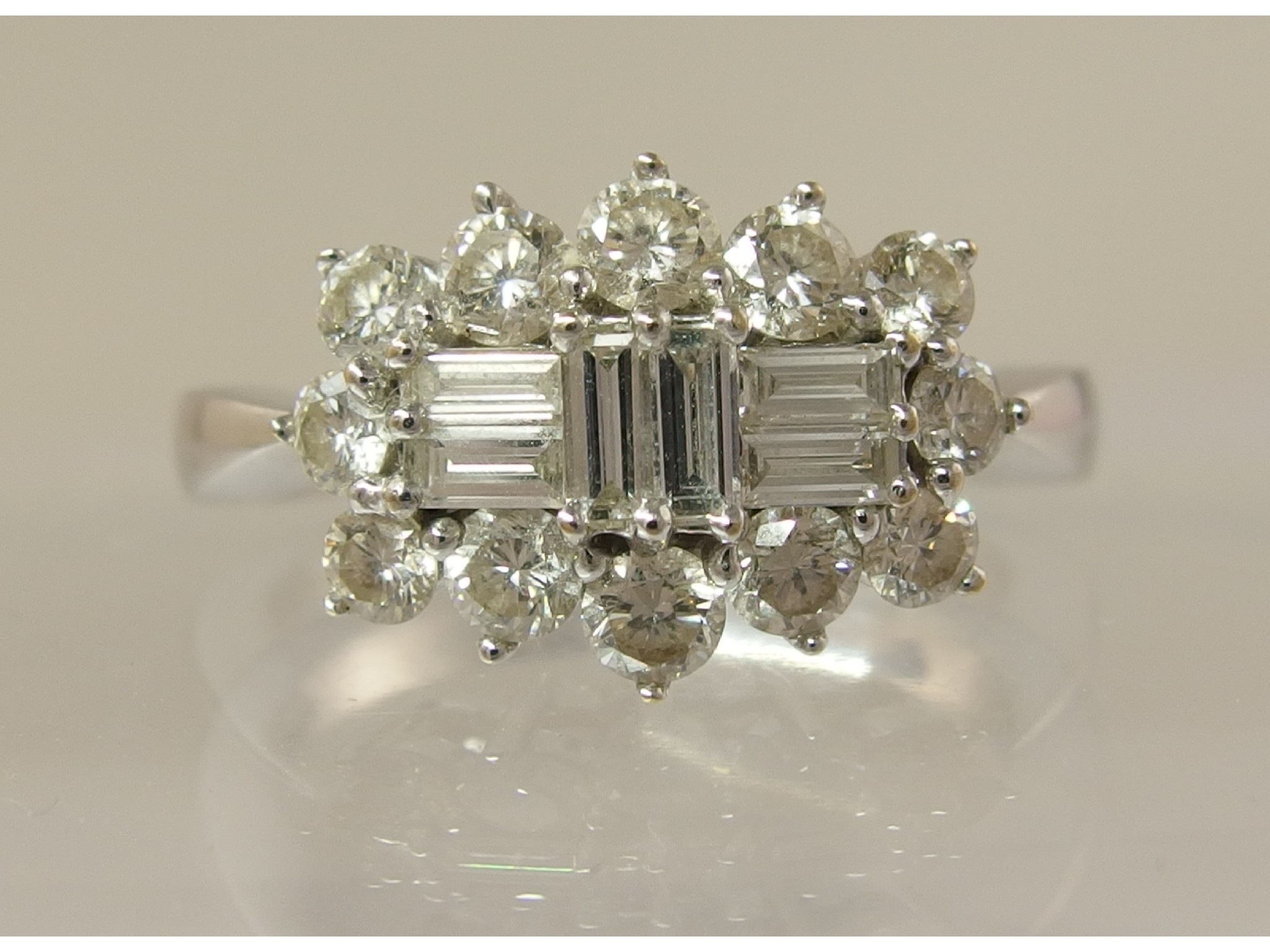 Appraisal: An ct white gold diamond cluster ringwith an approximate diamond