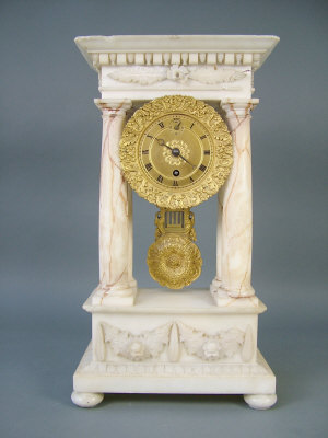 Appraisal: A th century French Empire style alabaster cased portico timepiece