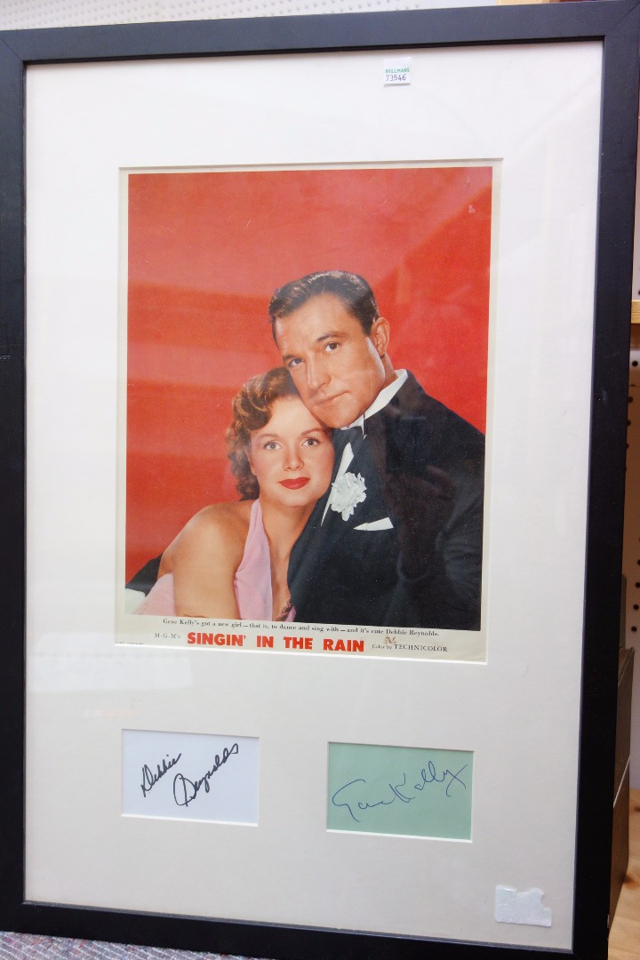 Appraisal: SINGIN' IN THE RAIN - mounted framed coloured promotional Lobby