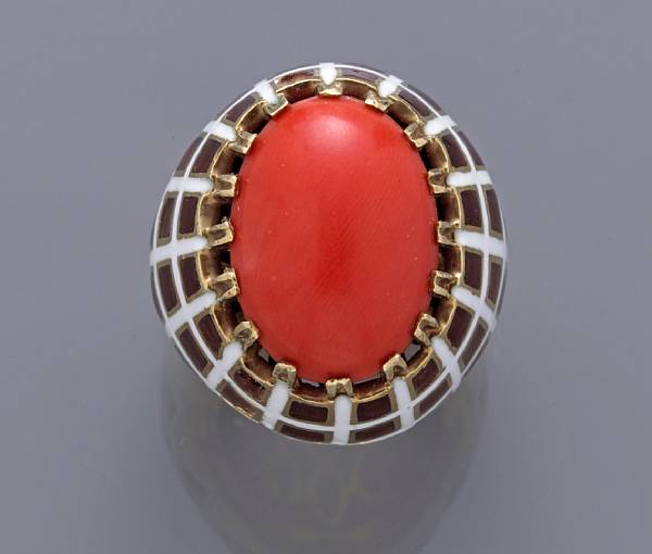 Appraisal: A coral and enamel ring mounted in fourteen karat gold