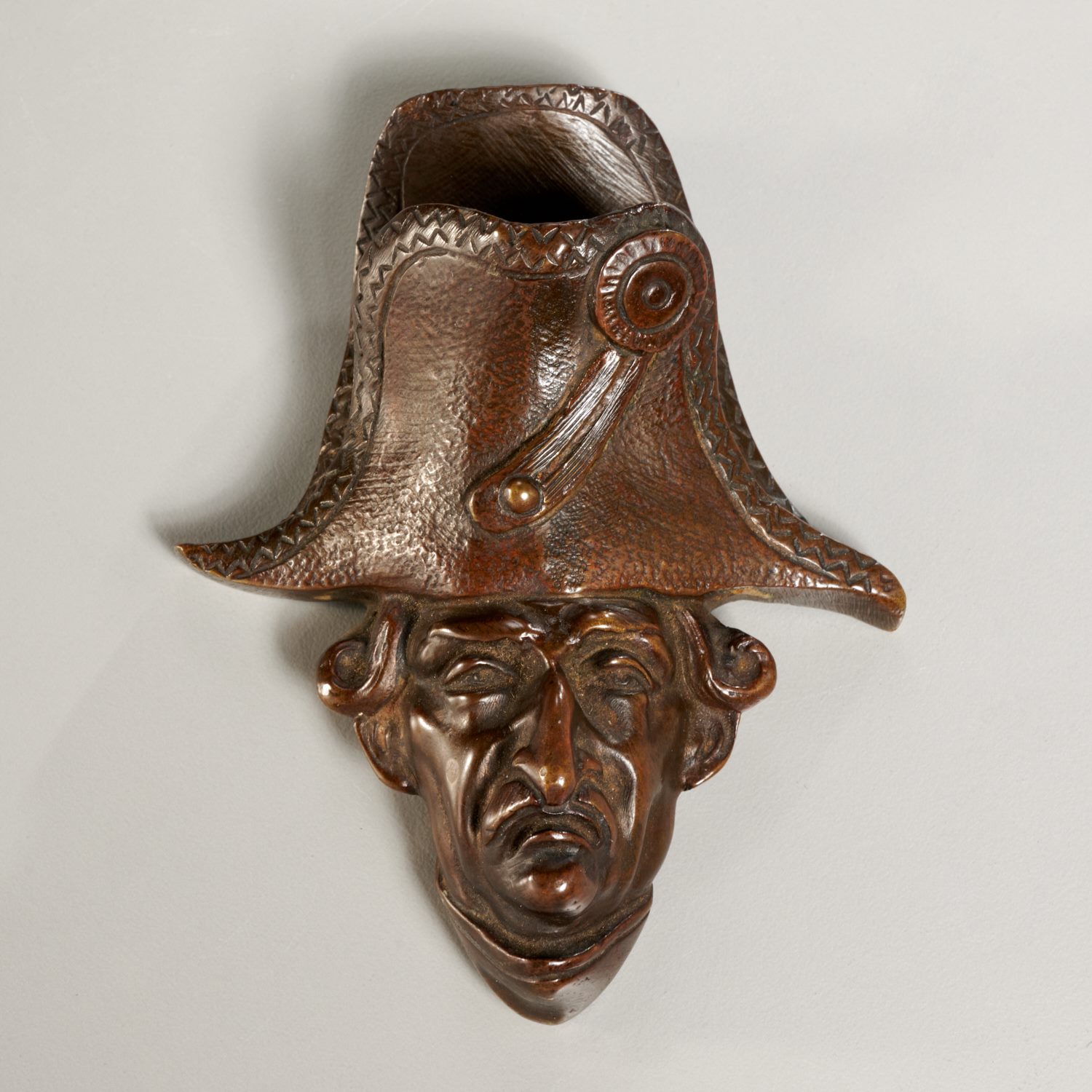 Appraisal: FRENCH BRONZE WALL-MOUNT FIGURAL MATCH HOLDER th c France brown