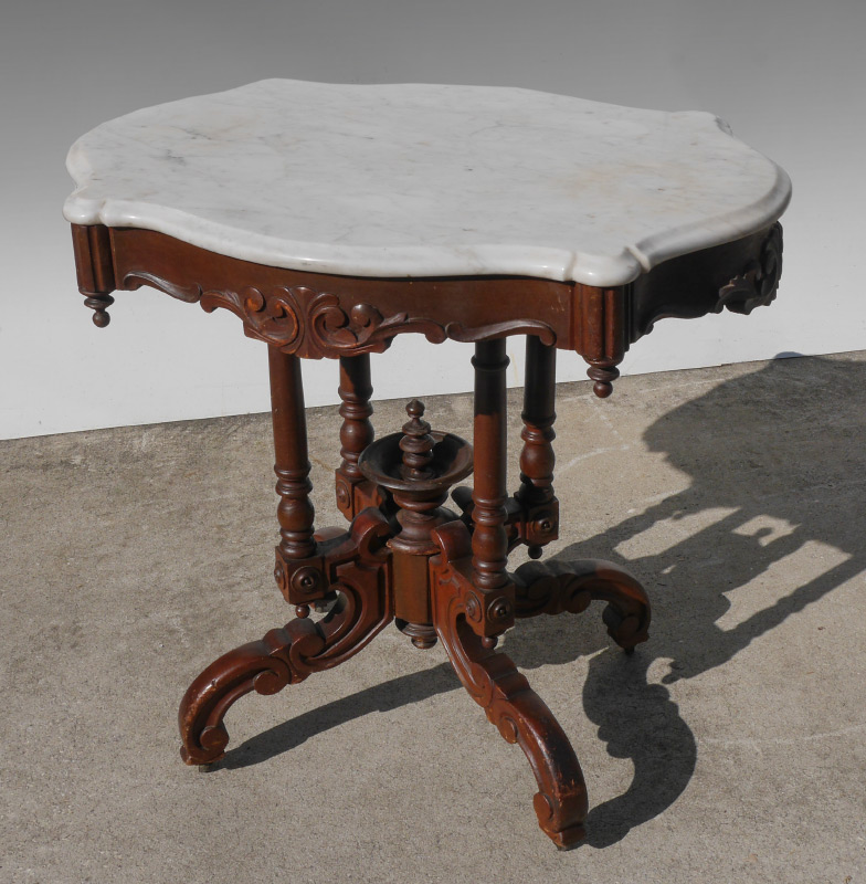 Appraisal: SHAPED WHITE MARBLE TOP VICTORIAN SIDE TABLE White beveled marble