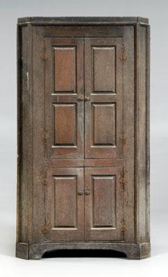 Appraisal: Georgia yellow pine corner cupboard single-case construction paneled doors with