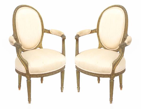 Appraisal: A pair of Louis XVI style carved and giltwood fauteuils