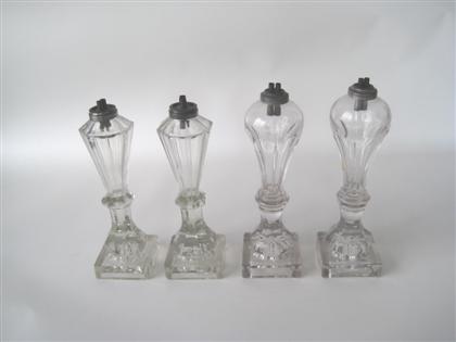 Appraisal: Two pairs of uncolored glass fluid lamps new england The