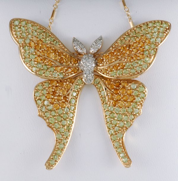 Appraisal: Luna moth pendant brooch with chain K gold x white