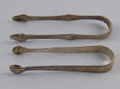 Appraisal: Two pairs of Georgian silver sugar tongs with bright cut