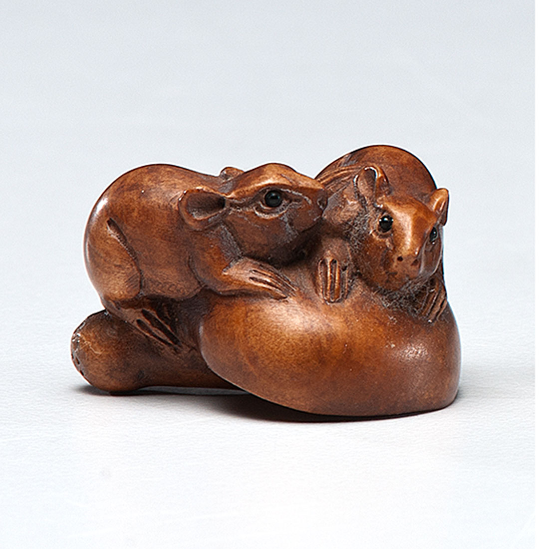 Appraisal: Japanese Meiji period A Katabori netsuke of wood carved artfully