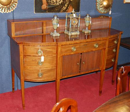 Appraisal: A George III mahogany bow front sideboard the raised back