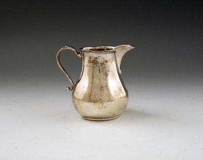 Appraisal: A silver cream jug by Wakely and Wheeler London baluster