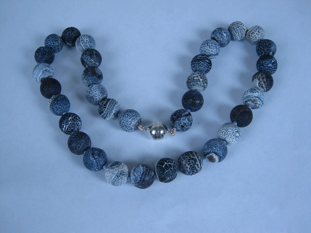 Appraisal: A Single row of Volcanic Rock Beads on silver magnetic