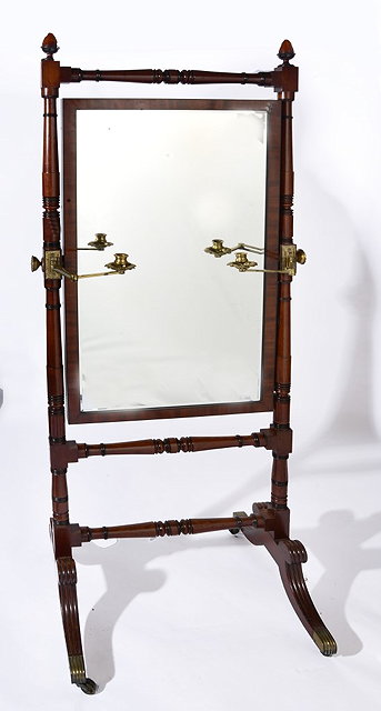 Appraisal: A TH CENTURY MAHOGANY CHEVAL MIRROR with turned supports brass