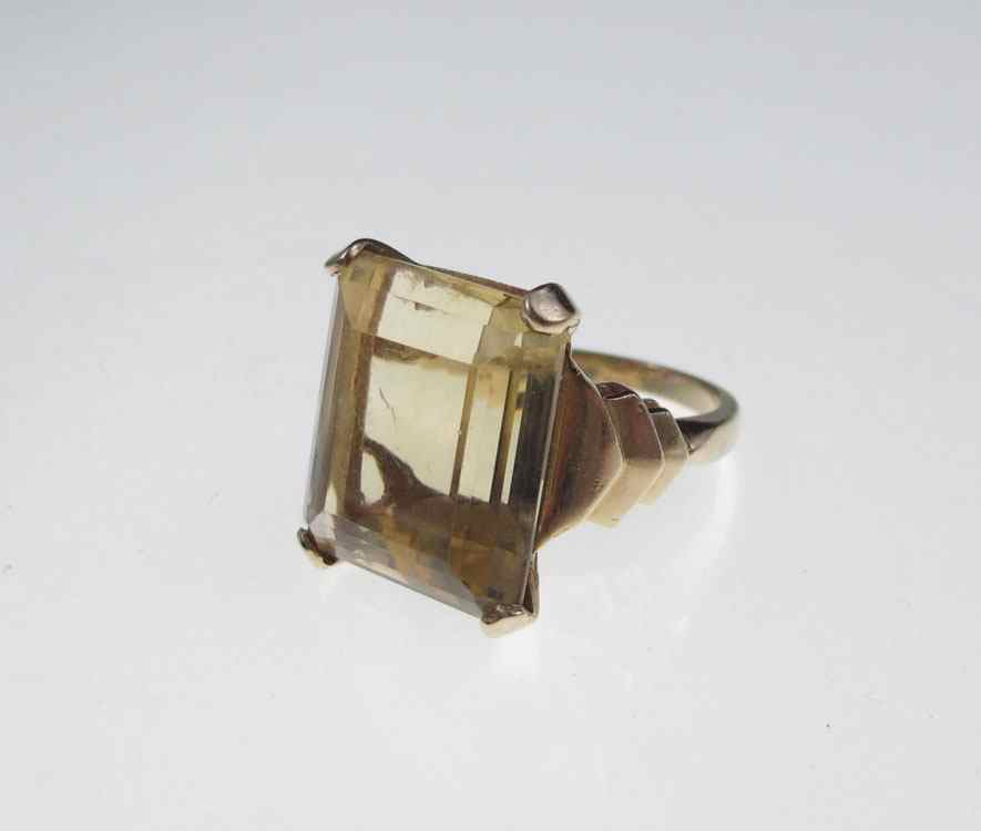 Appraisal: CT CITRINE RING K yellow gold ring contains one emerald