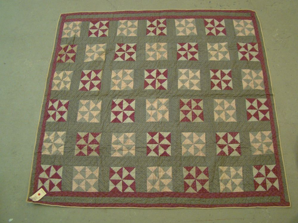 Appraisal: PIECED QUILT Late th Early th CenturyIn a multicolor triangular