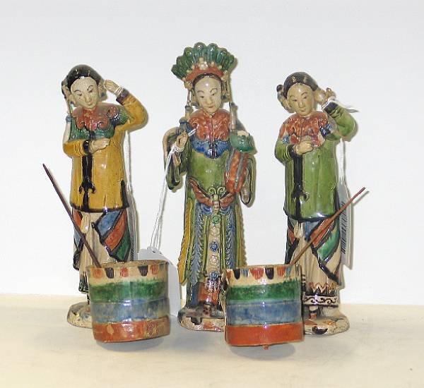 Appraisal: Three polychrome glazed ceramic figures Including a beauty in theatrical