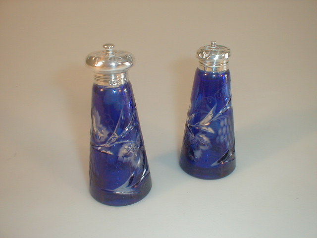 Appraisal: A pair of late thC blue flashed pepperettes engraved with