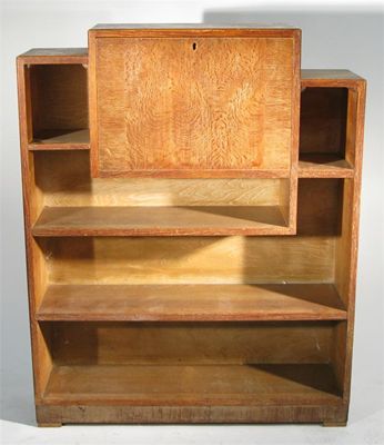 Appraisal: A Heal's limed oak student bureau bookcase applied ivorine roundel