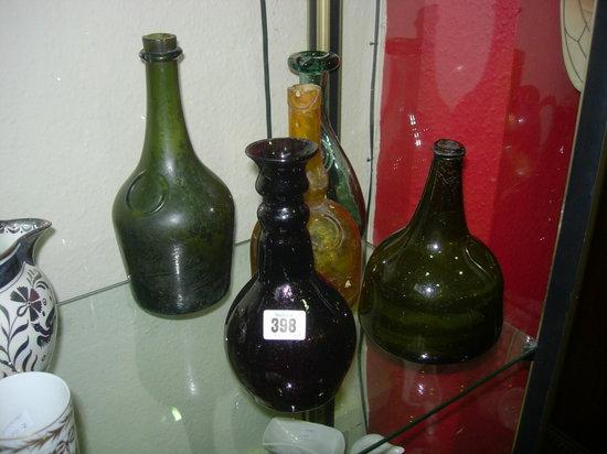 Appraisal: AN OLD GREEN WINE BOTTLE an amethyst carafe and three