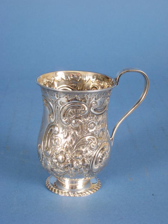 Appraisal: A Victorian baluster Christening Mug floral and leafage scroll embossed