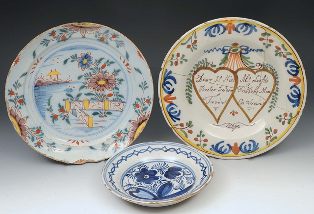 Appraisal: A DUTCH DELFT MARRIAGE PLATE decorated in coloured enamels with