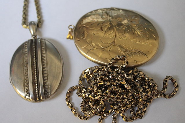 Appraisal: TWO LOCKETS both with ct gold guard chains grams