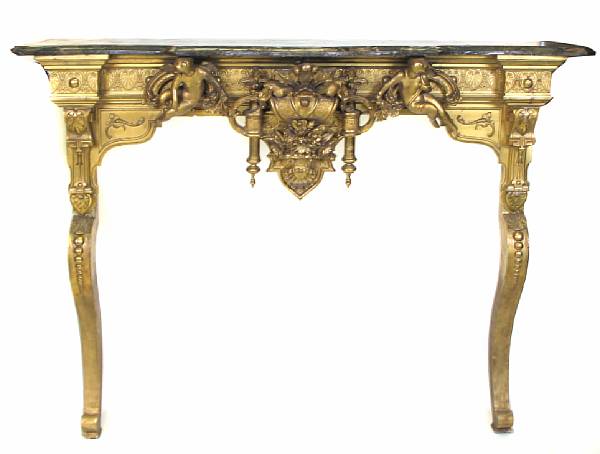 Appraisal: A French carved and gilt fireplace surround with faux marble