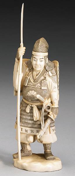 Appraisal: An ivory okimono of a warrior Standing in classical samurai