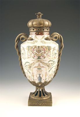 Appraisal: An earthenware and brass mounted vase with polychrome decoration having