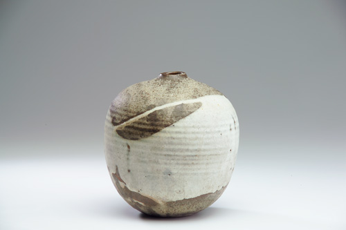 Appraisal: TOSHIKO TAKAEZU Ridged stoneware vessel with small opening covered in