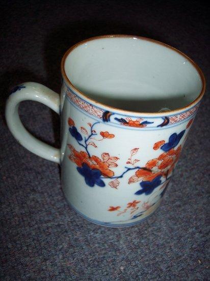 Appraisal: An early th Century Imari tankard painted chrysanthemums and gardens