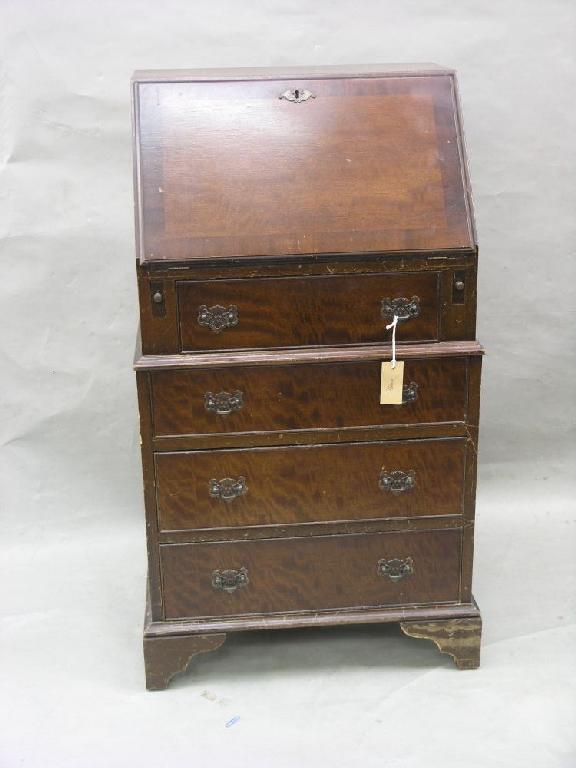 Appraisal: A reproduction mahogany lady's bureau cross-banded fall front enclosing interior