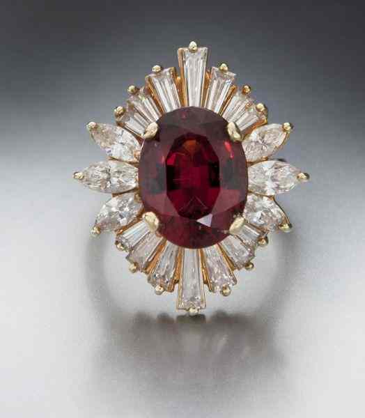 Appraisal: K gold rhodalite garnet and diamond ringfeaturing an oval brilliant