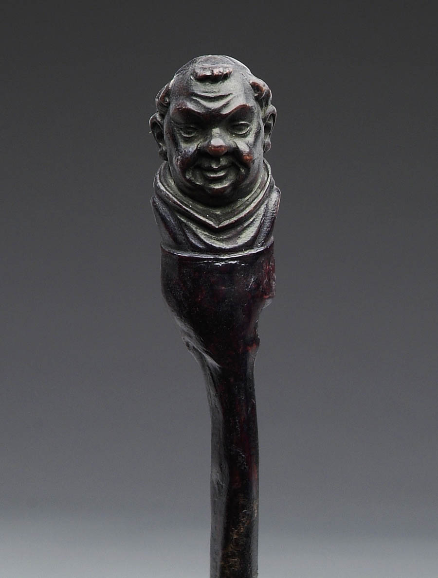 Appraisal: CARVED MONK HANDLE CANE One piece wood cane has carved