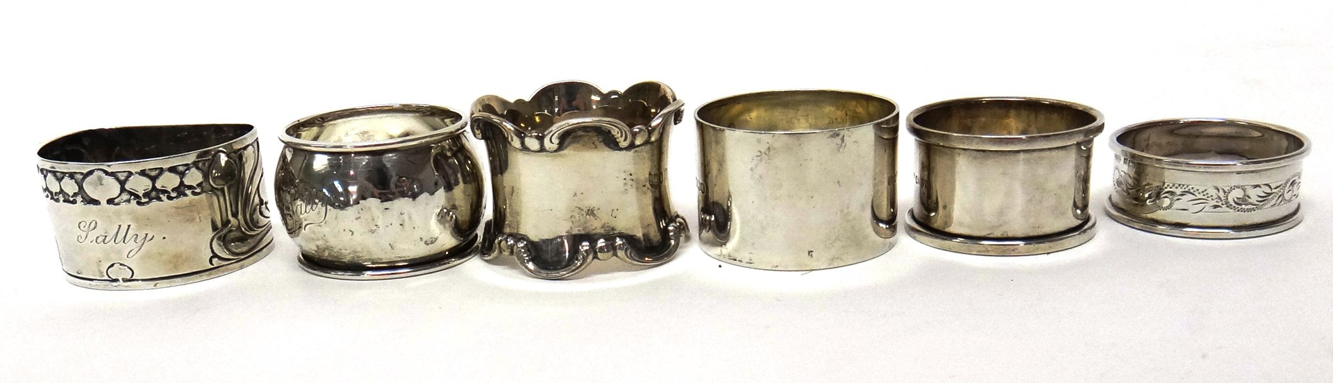 Appraisal: A silver napkin ring of 'D' shaped form with Art