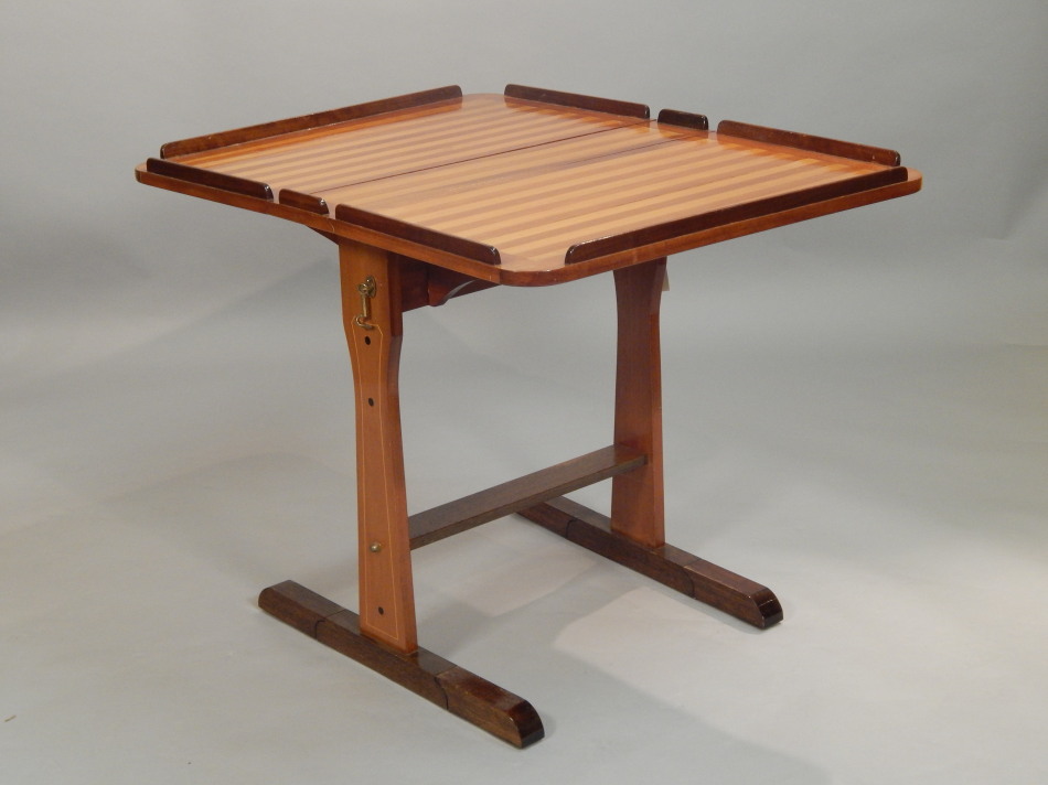 Appraisal: A teak and mahogany ships drop leaf table with raised