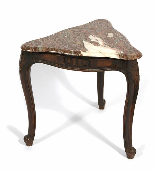 Appraisal: An Italian Rococo style walnut table with triangular marble top