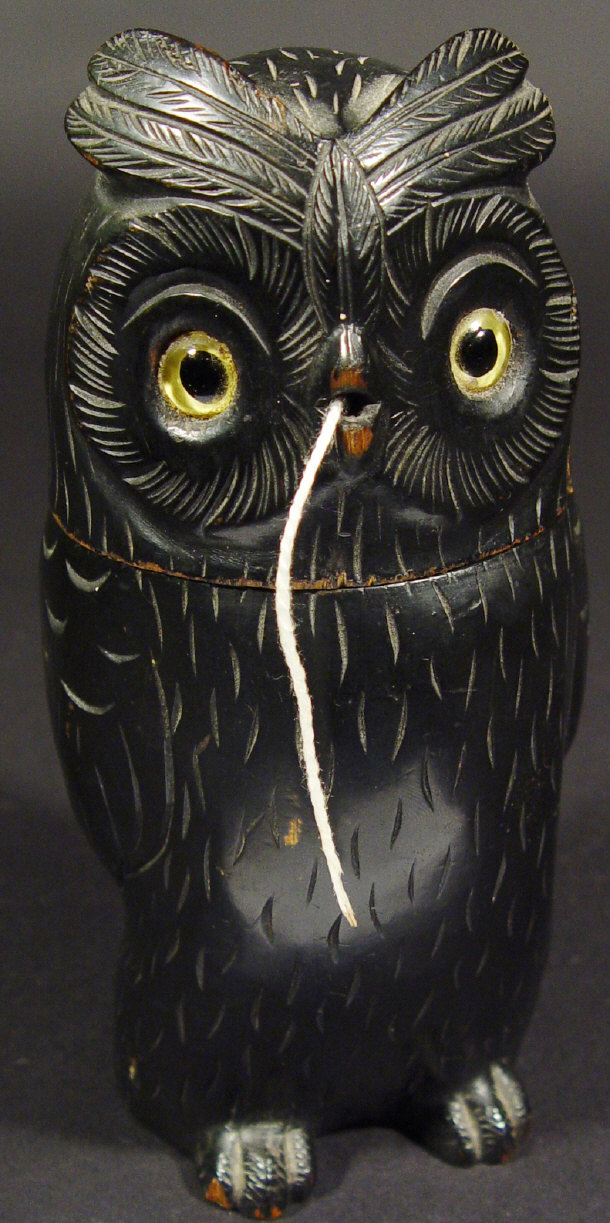 Appraisal: Ebonised wooden owl string box with detachable head and glass