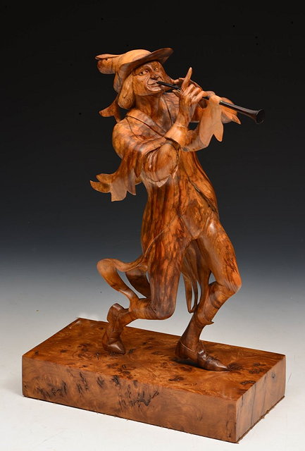 Appraisal: IAN NORBURY b A carved burr walnut sculpture 'Pied Piper'